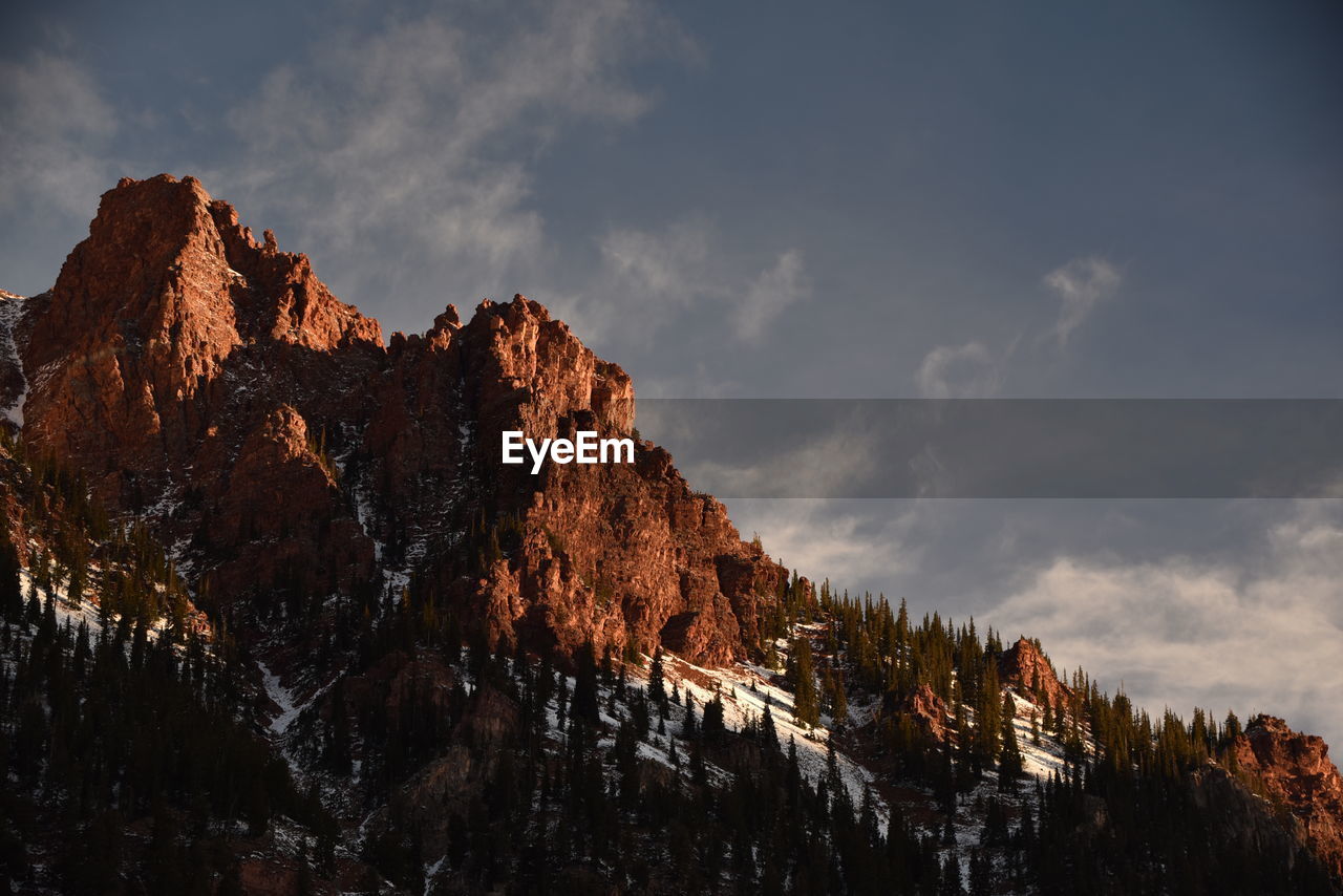 Low angle view of rocks against sky