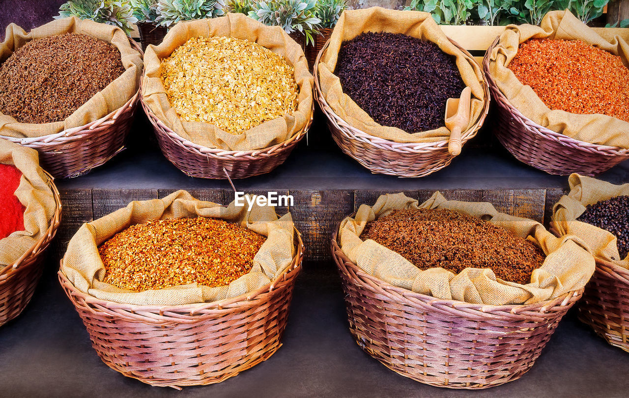 Various grains in baskets at market stall