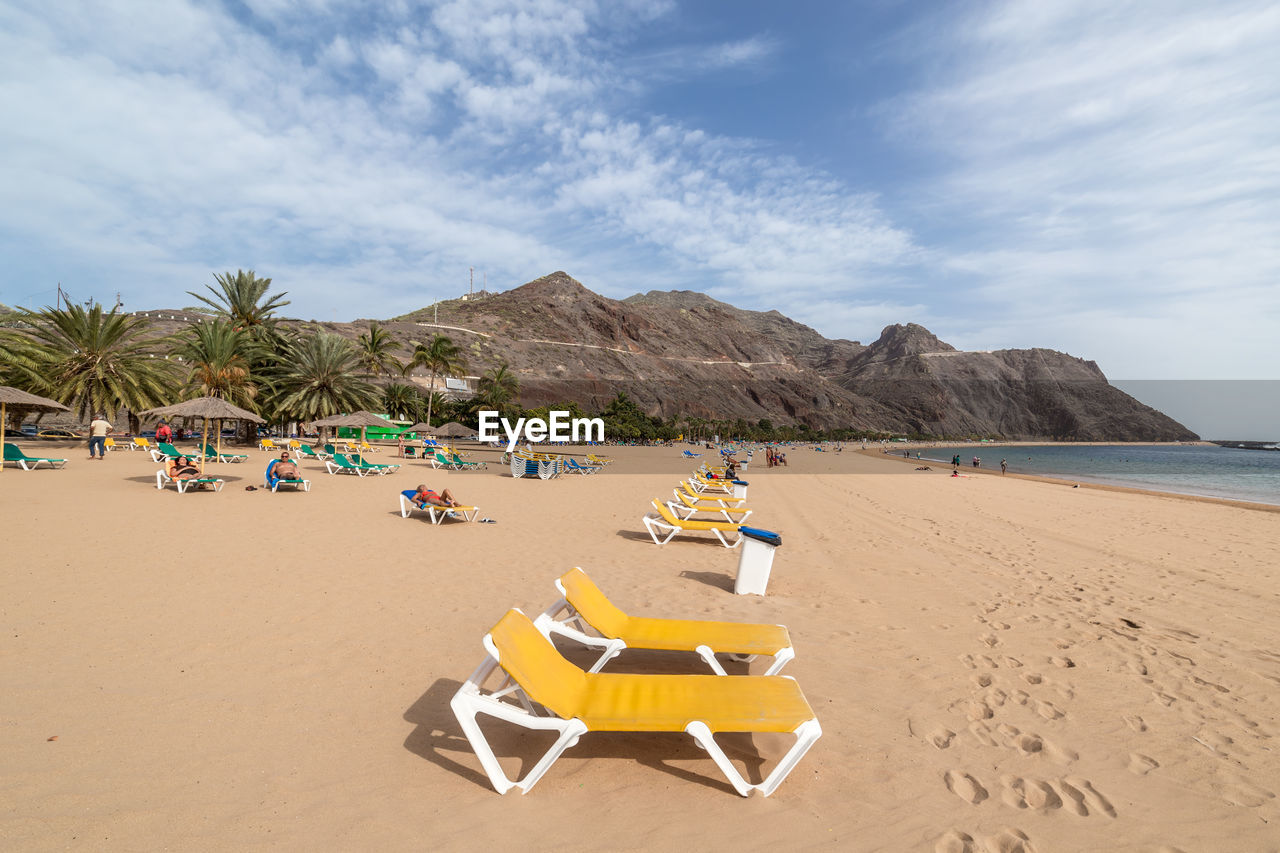 LOUNGE CHAIRS ON BEACH