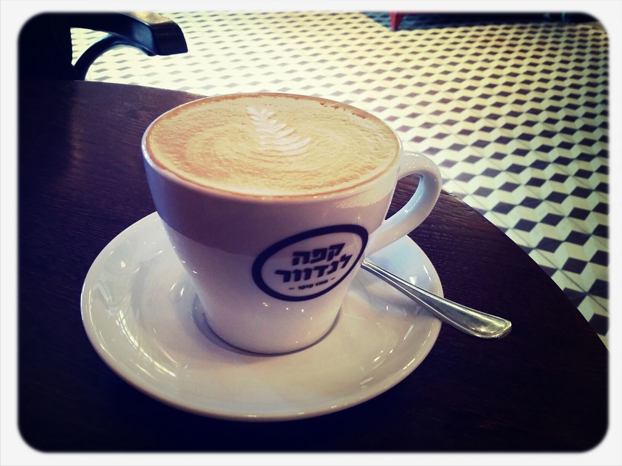 CLOSE-UP OF COFFEE CUP WITH COFFEE CUP