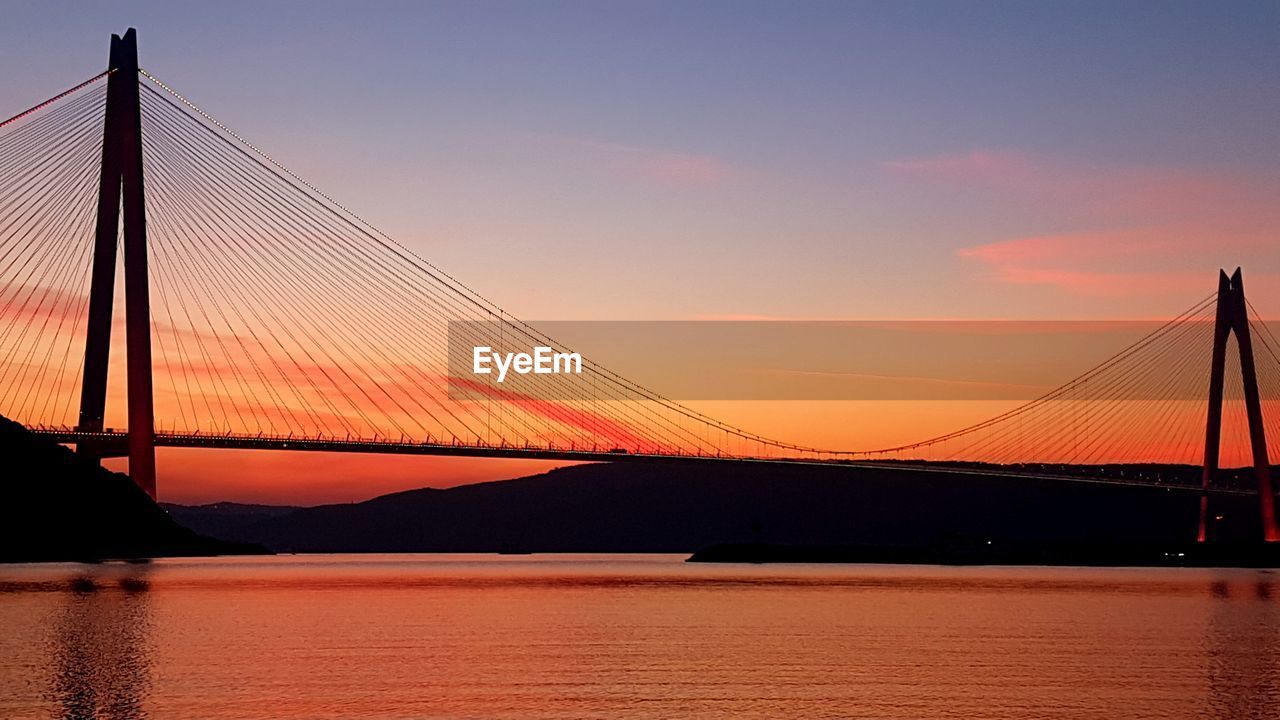 View of suspension bridge at sunset