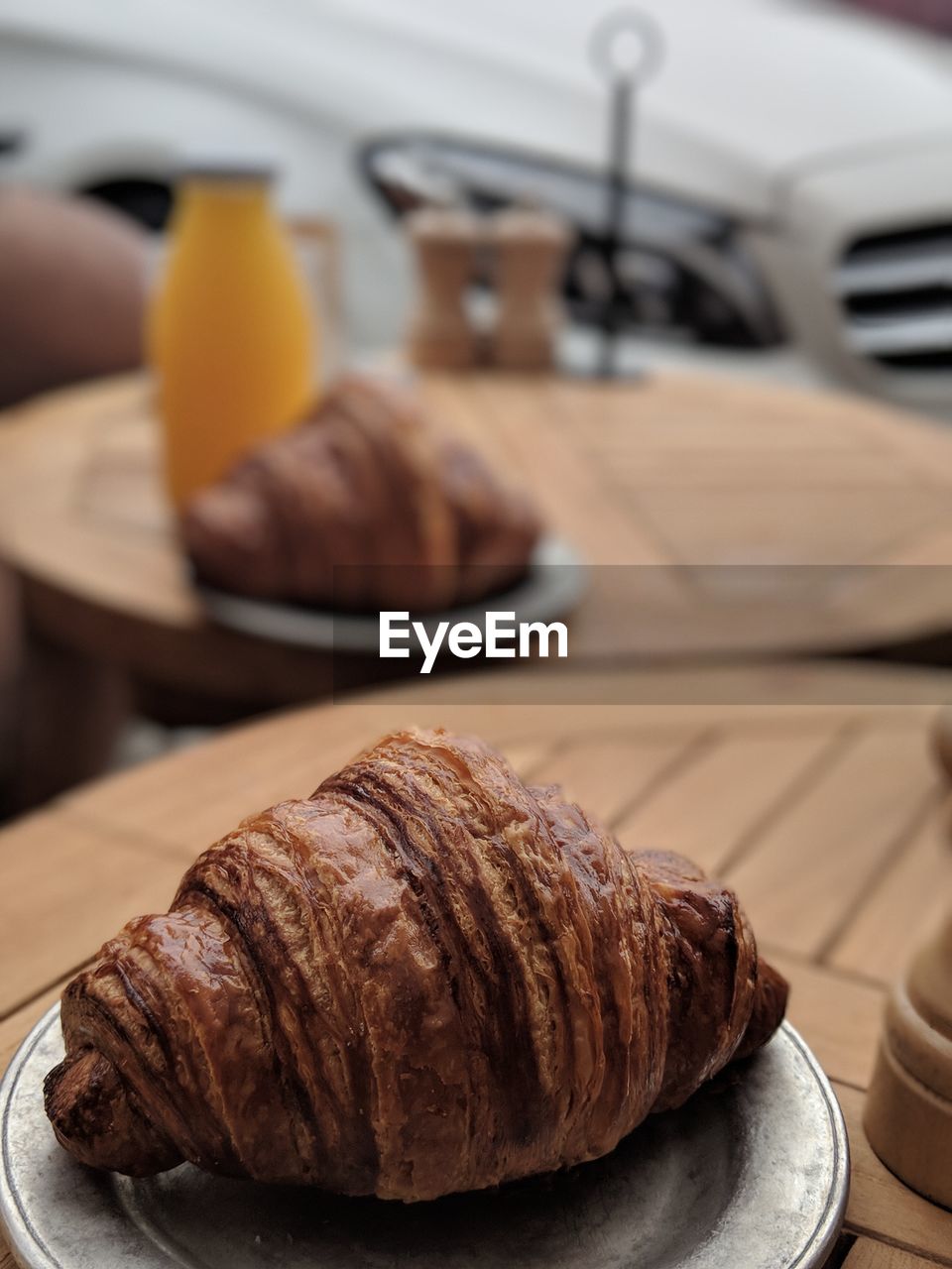 Close-up of croissant in plate on table