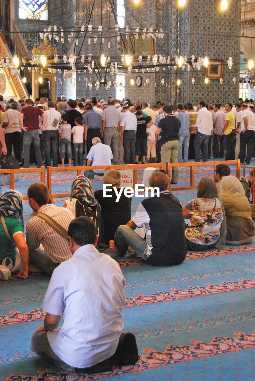 Group of people praying in the mosque