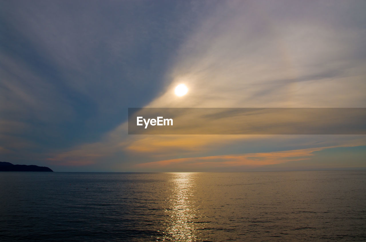 Scenic view of sea against sky at sunset