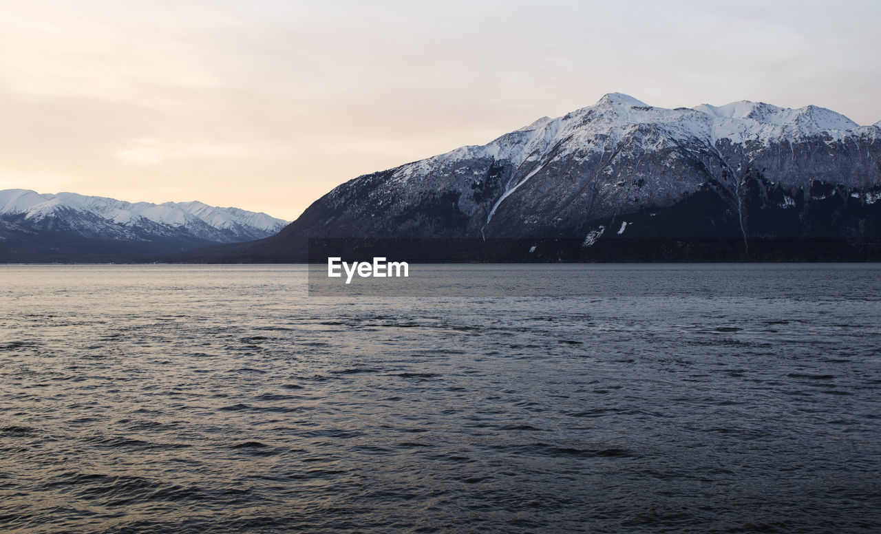 Scenic view of mountains against sky during sunset