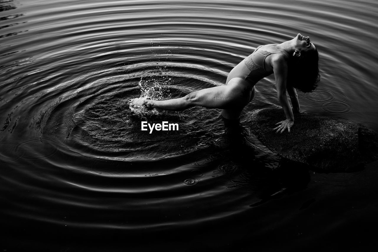 High angle view of man swimming in lake