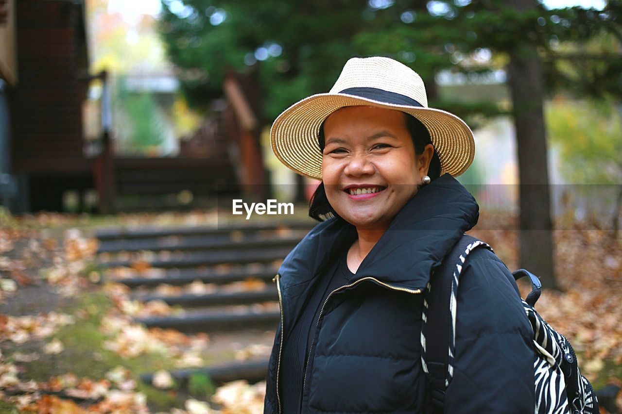 Portrait of smiling mature woman at park