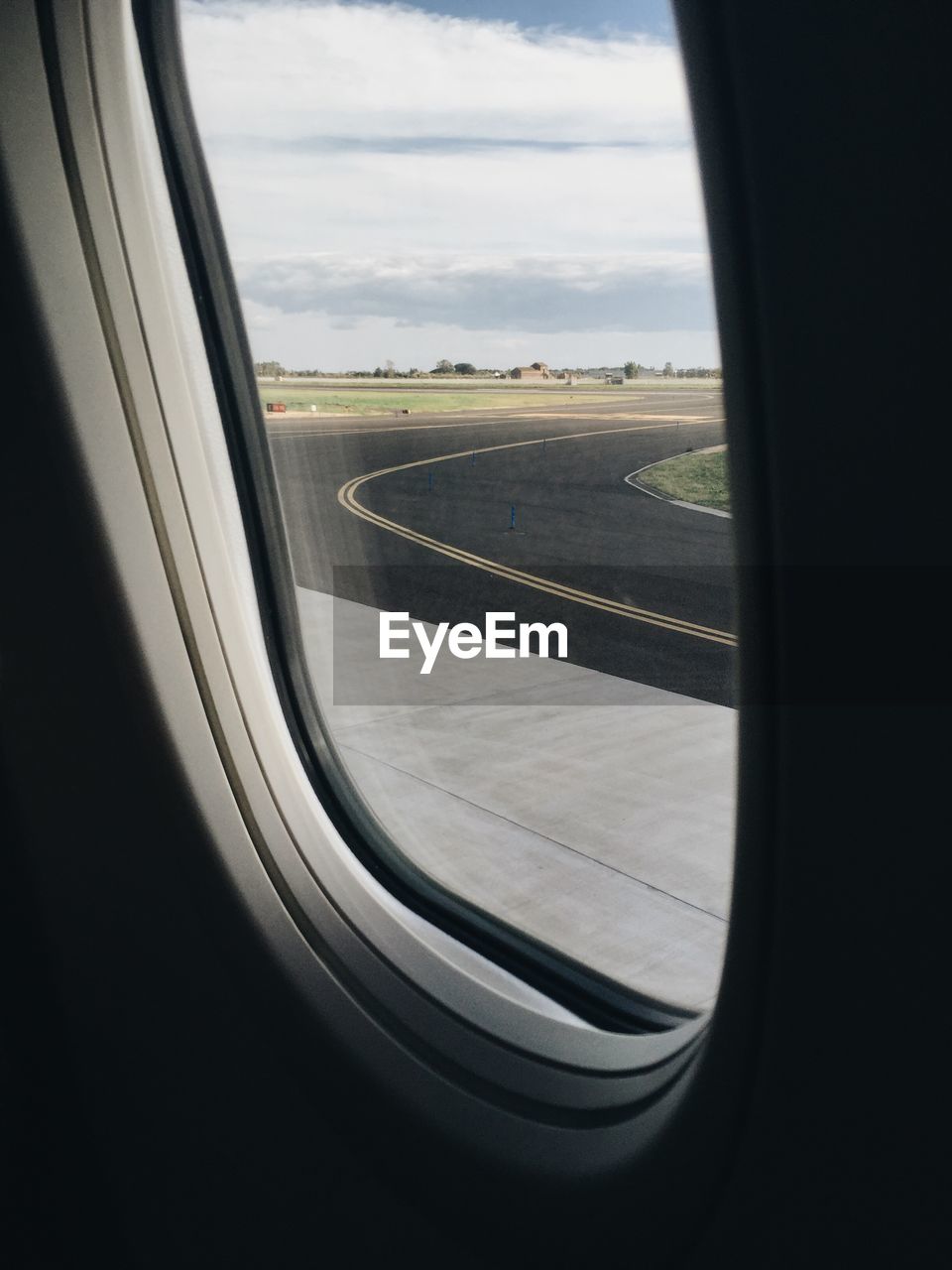 Airplane wing seen through airplane window