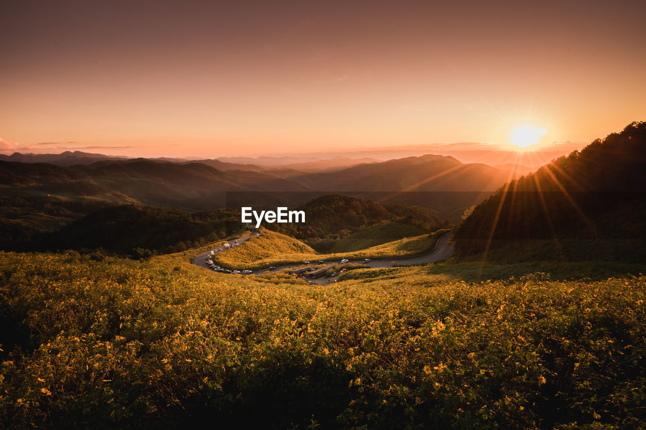 Scenic view of landscape against sky during sunset