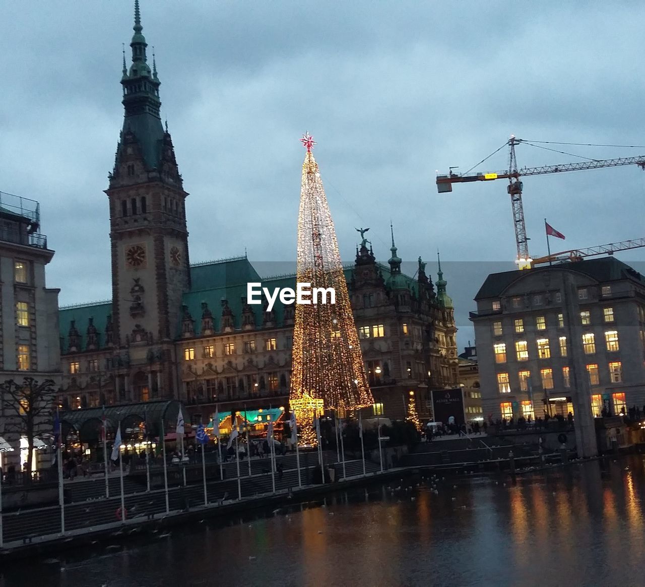 VIEW OF ILLUMINATED CITY AGAINST SKY