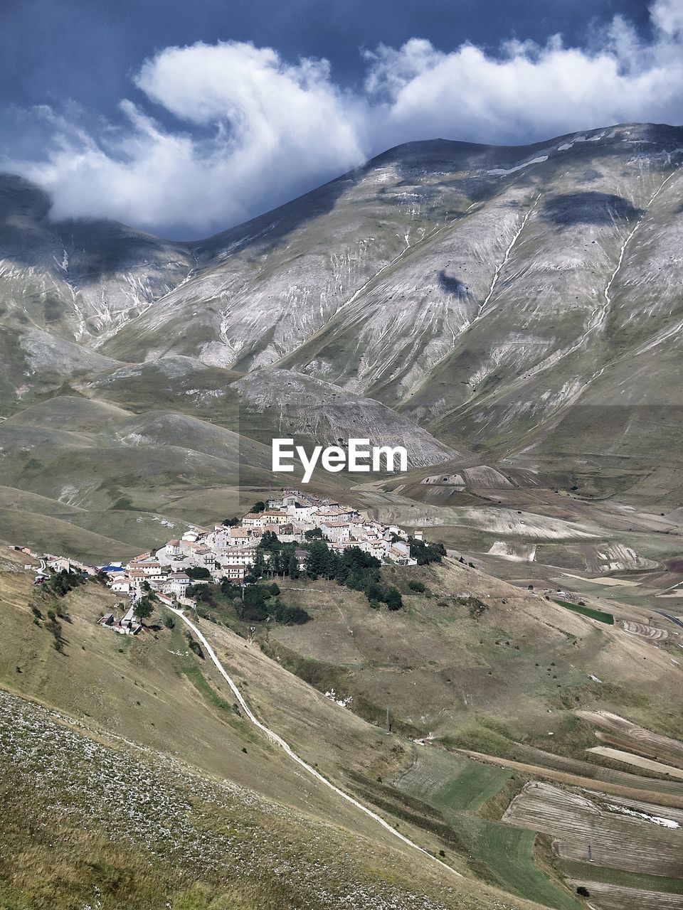 High angle view of castelluccio by mountains