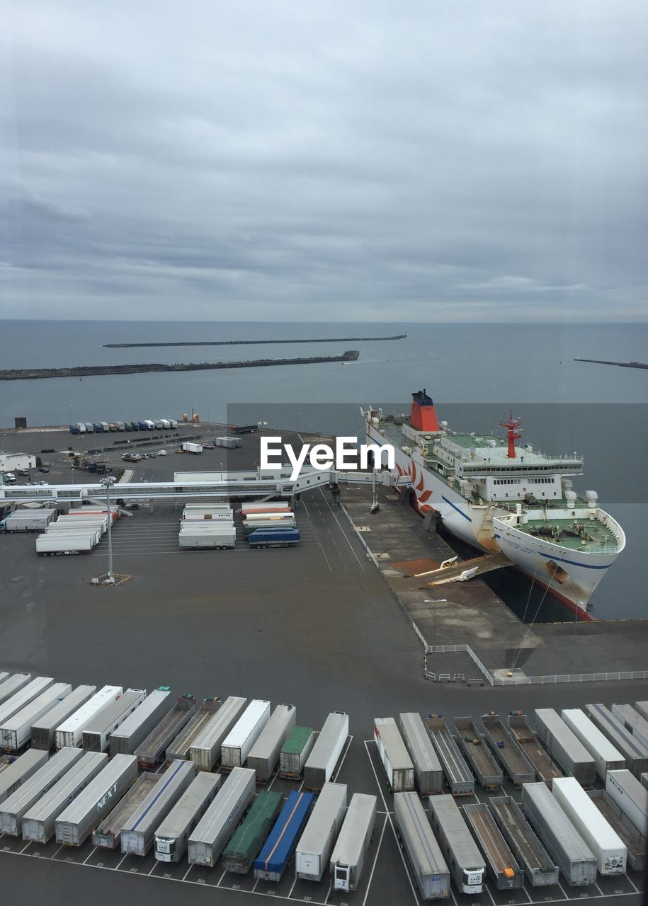 HIGH ANGLE VIEW OF SHIP MOORED ON SEA