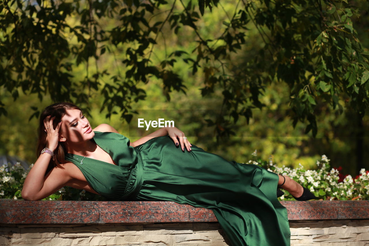 Full length of woman lying down outdoors