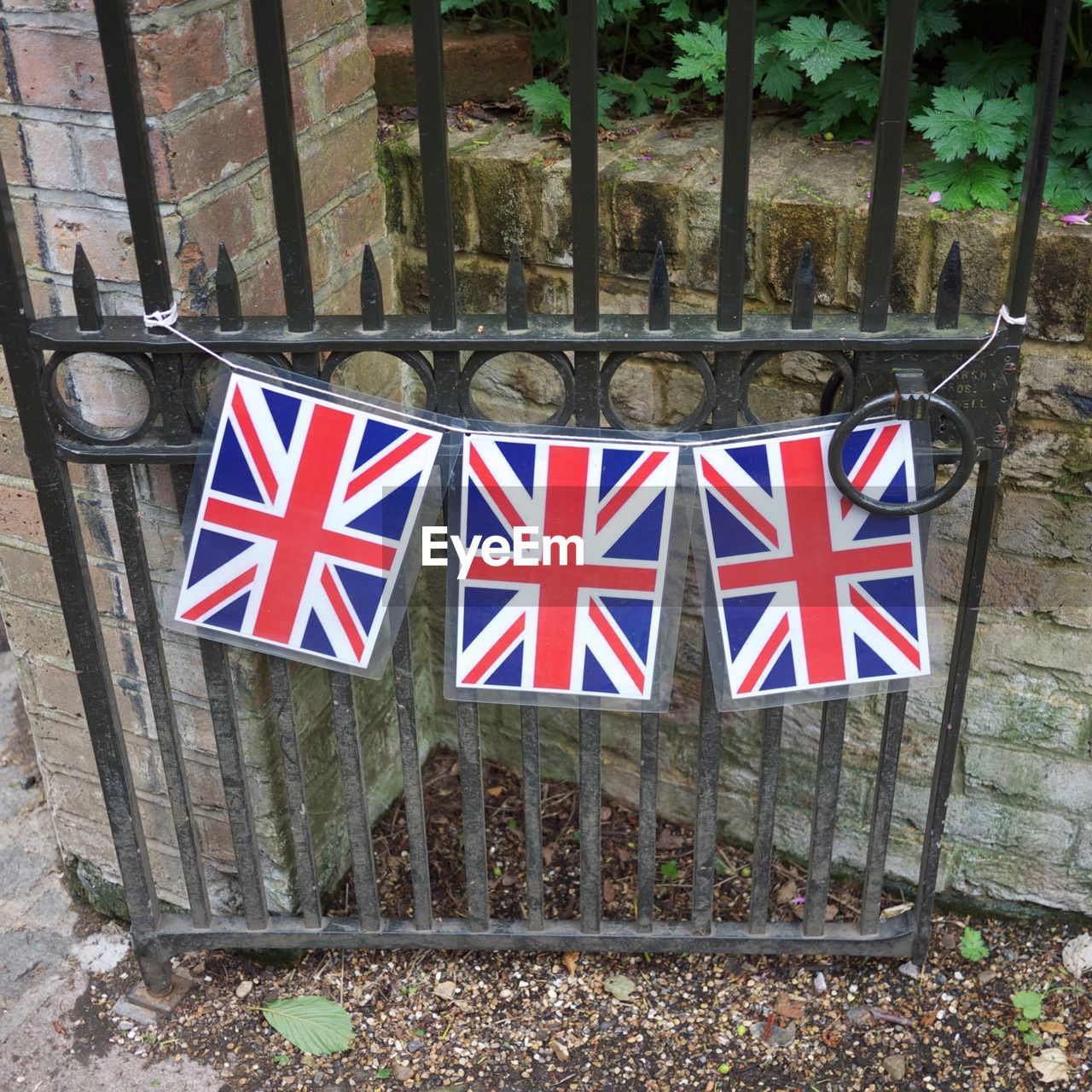 High angle view of british flags on gate