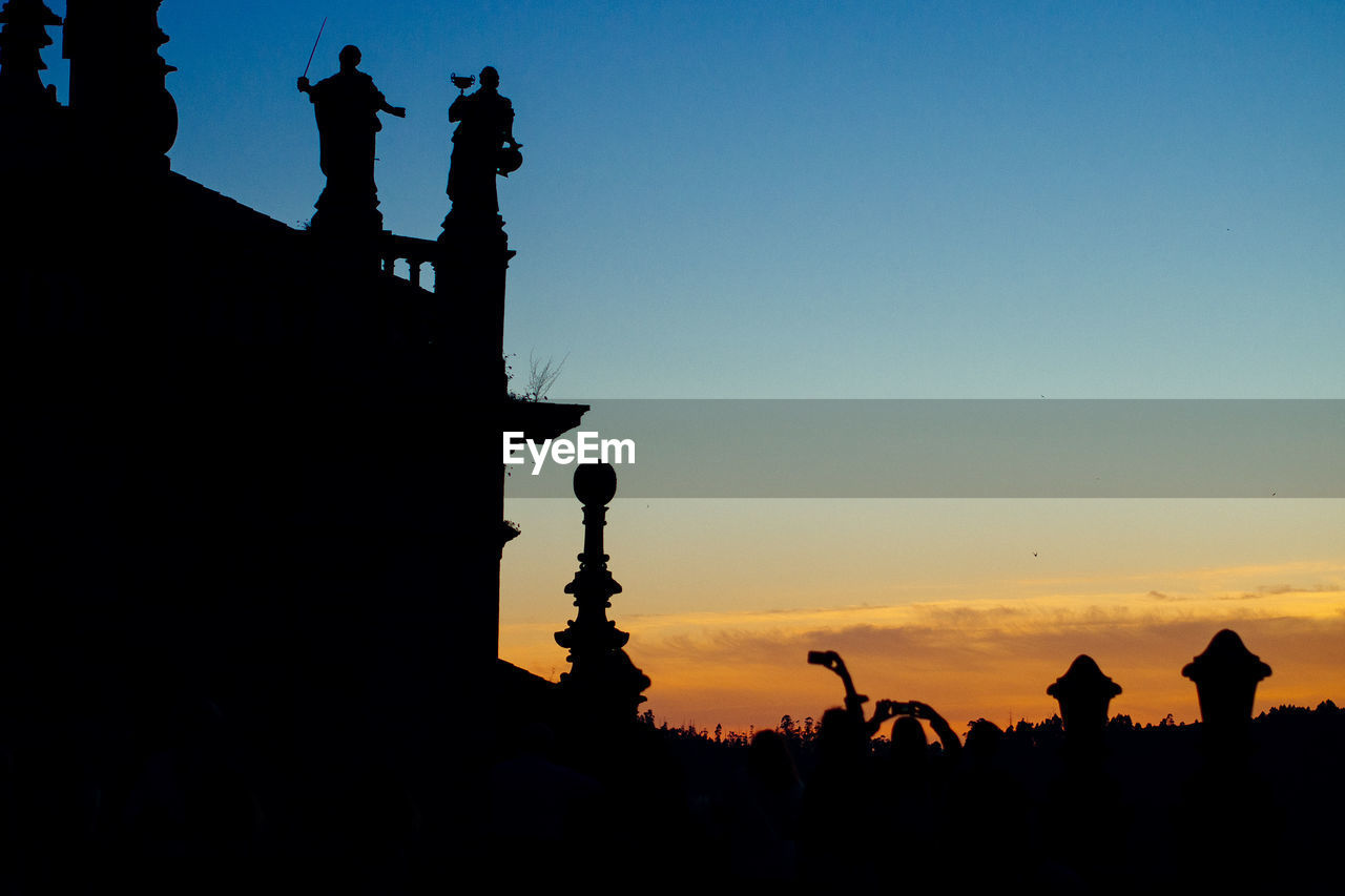 Silhouette church against sky during sunset