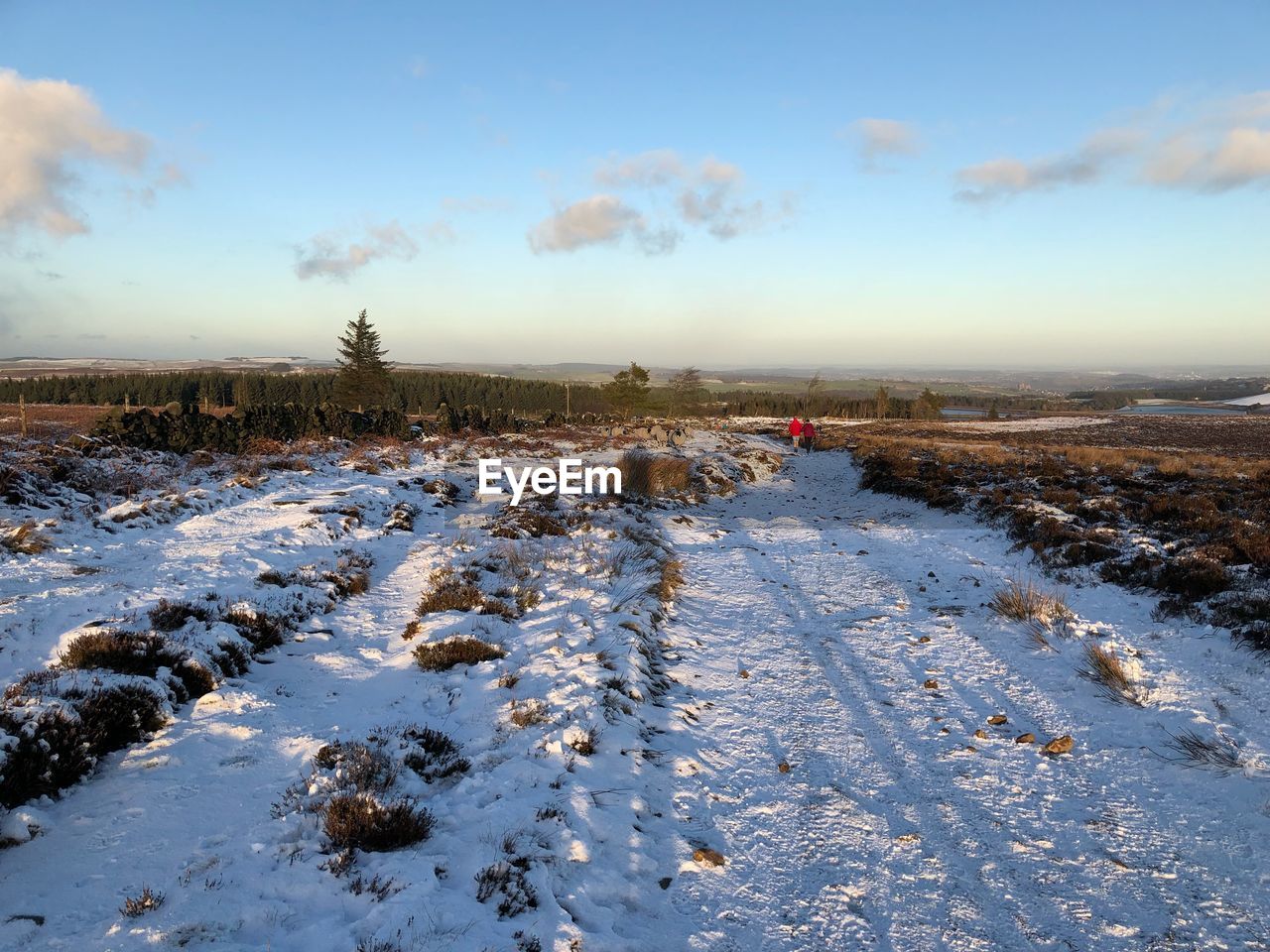 Snow covered landscape against sky