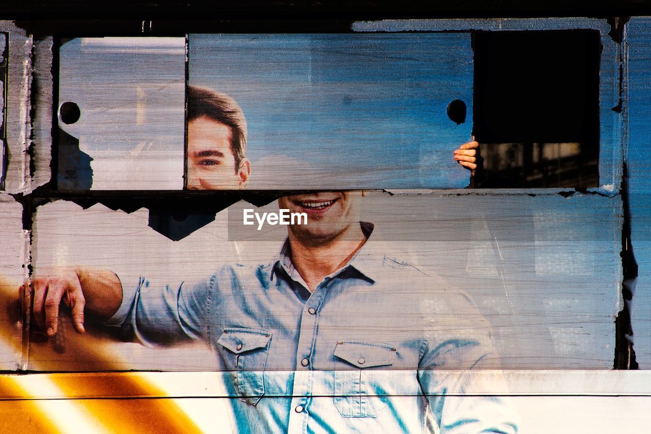 DIGITAL COMPOSITE IMAGE OF MAN WITH WINDOW