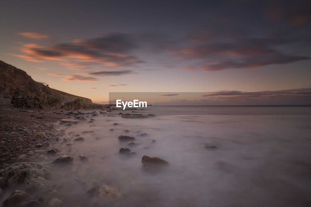 Scenic view of sea against sky during sunset