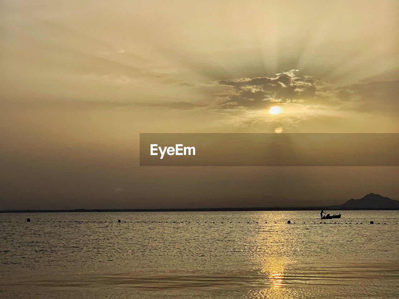 SCENIC VIEW OF BEACH AGAINST SKY DURING SUNSET