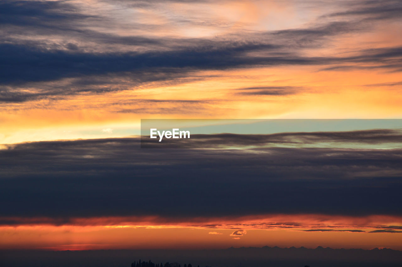 Scenic view of dramatic sky during sunset