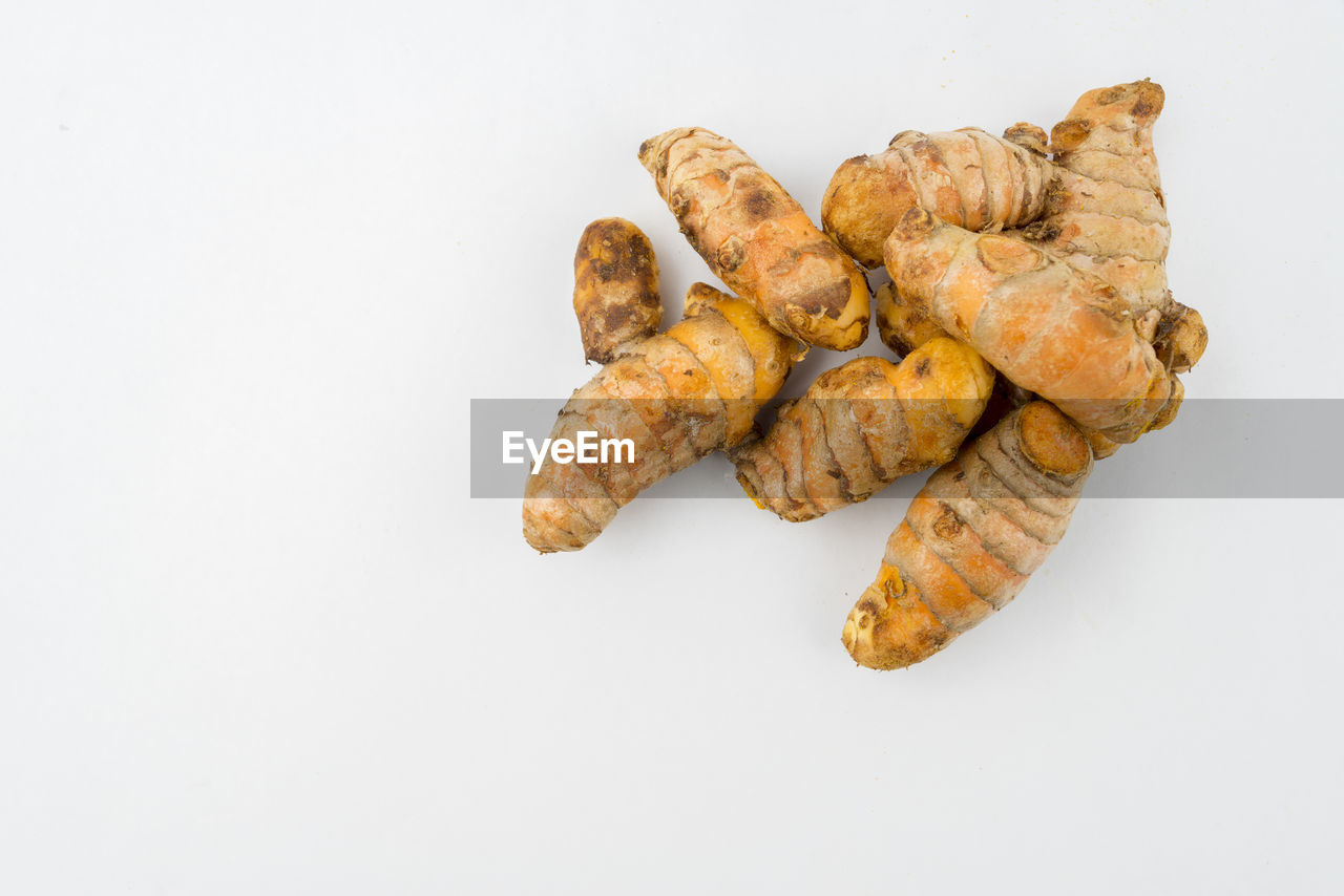 HIGH ANGLE VIEW OF BREAD ON WHITE BACKGROUND