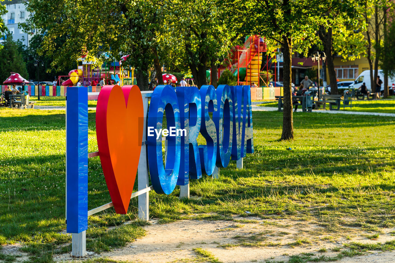 MULTI COLORED CHAIRS IN PARK