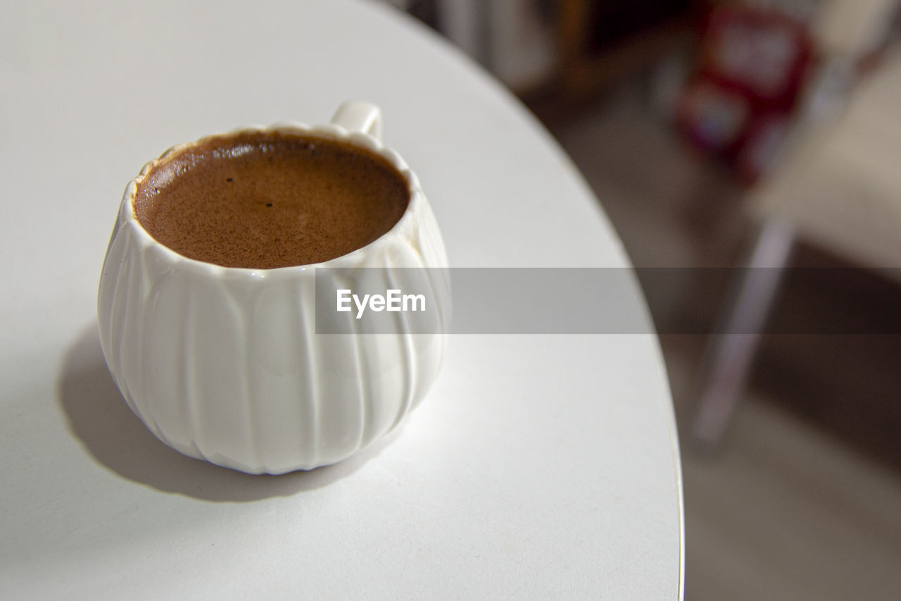 High angle view of coffee cup on table