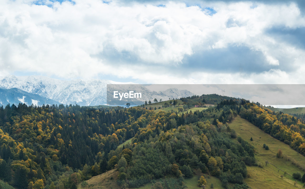 Scenic view of tree mountains against sky