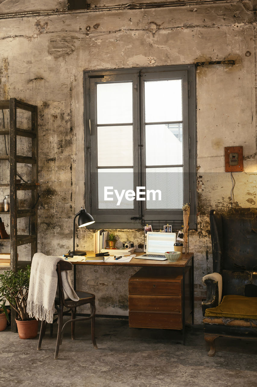 Desk with laptop in a loft