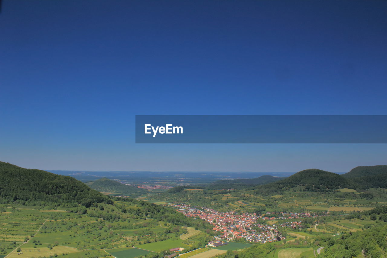 Scenic view of landscape against clear blue sky