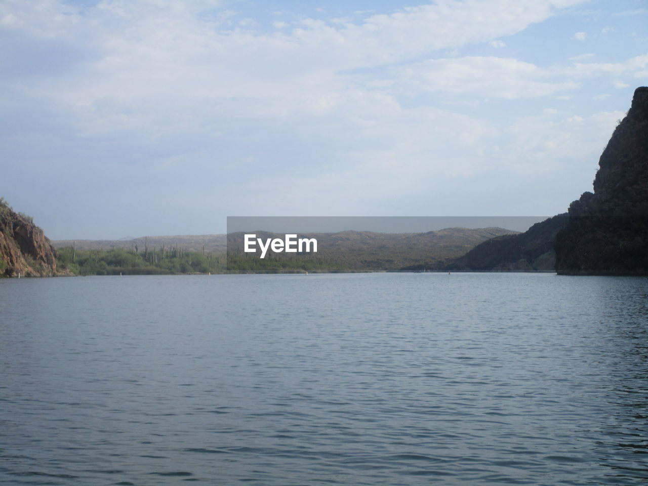 SCENIC VIEW OF RIVER AND MOUNTAINS