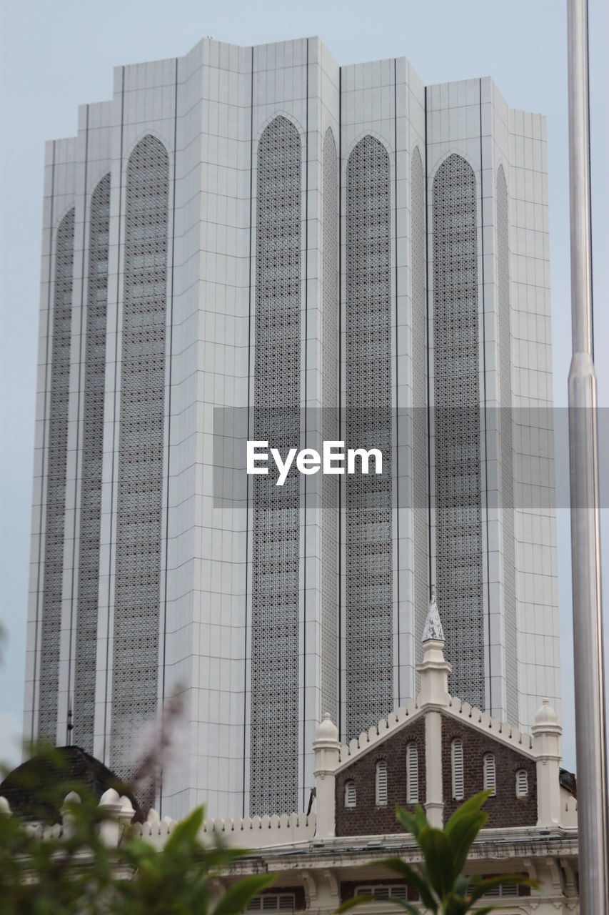 Low angle view of modern buildings against sky