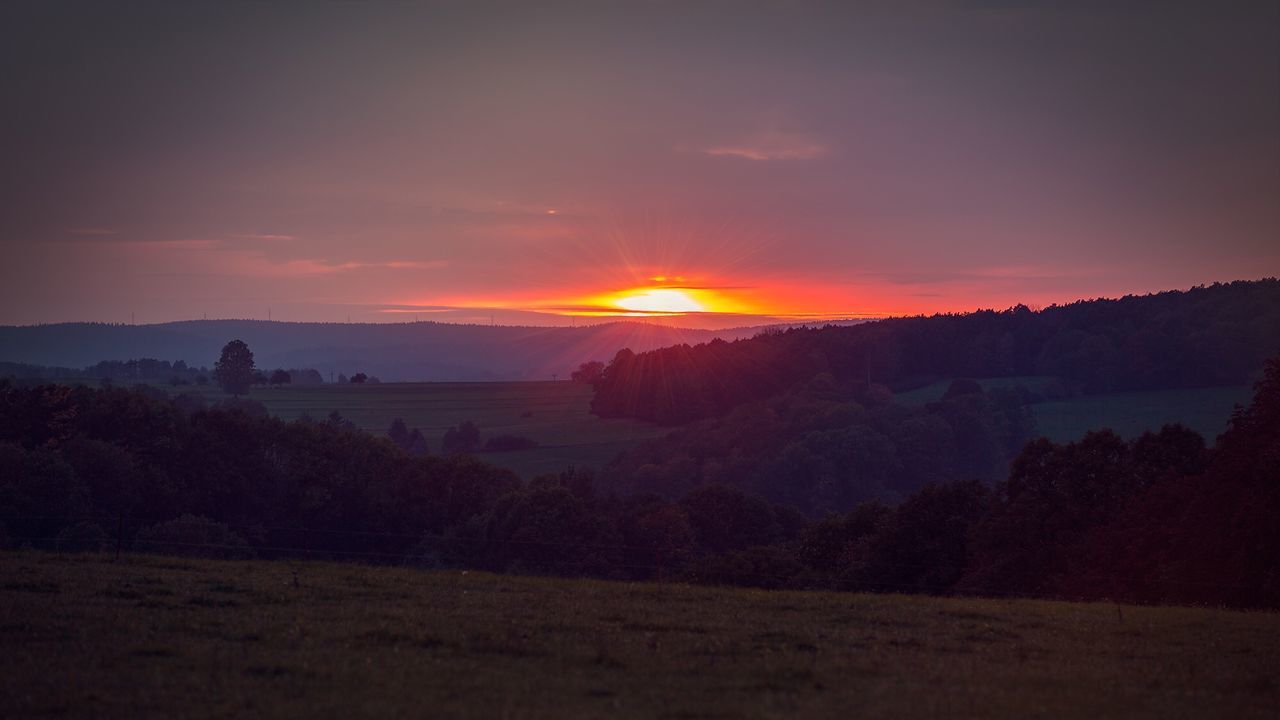 SCENIC VIEW OF SUNSET OVER LAND