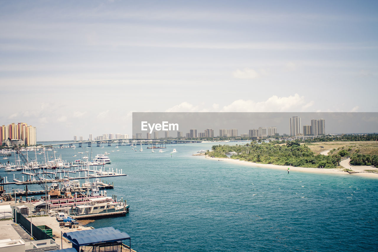 Scenic view of harbor against sky