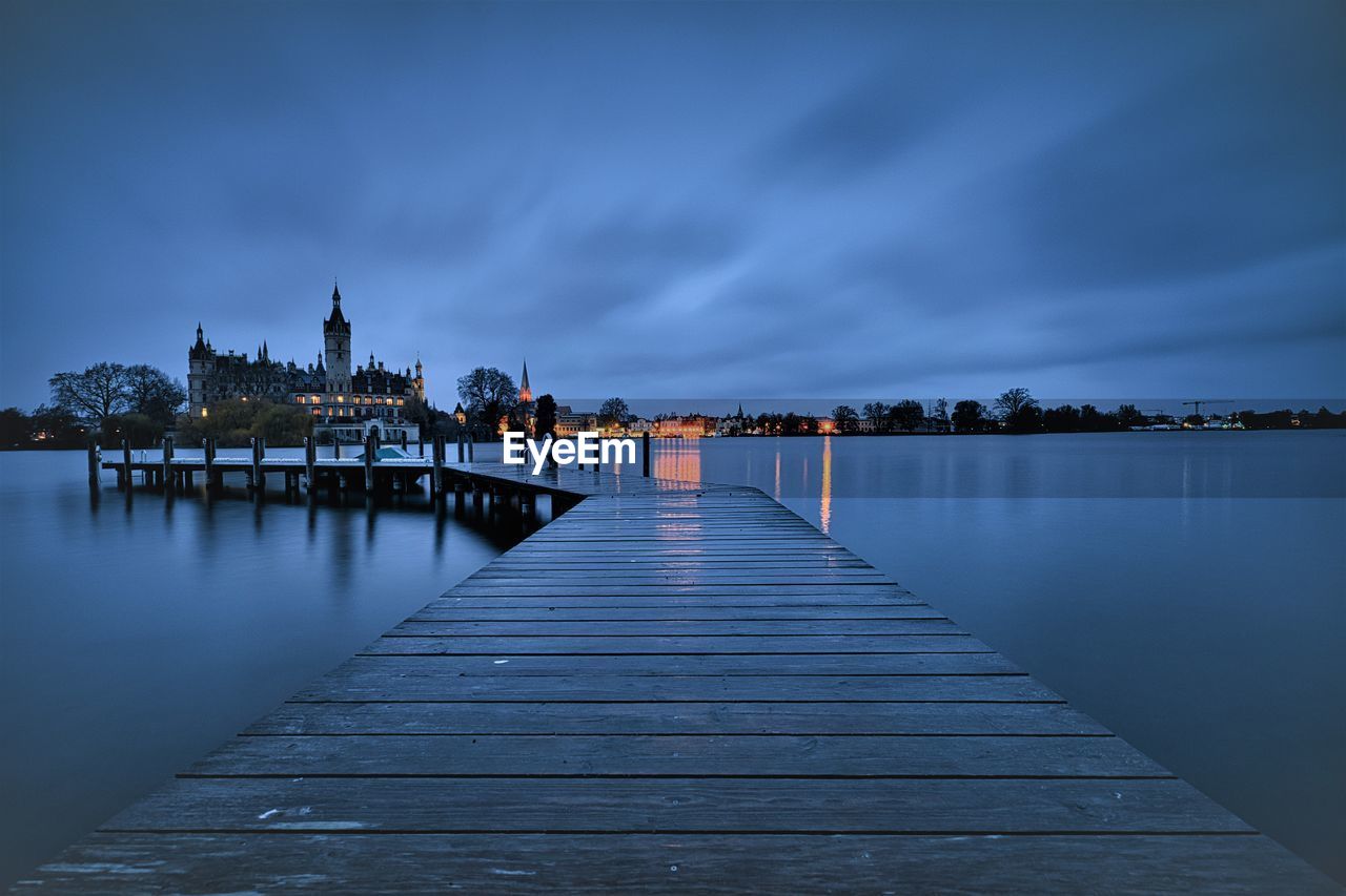 PIER OVER LAKE AGAINST SKY