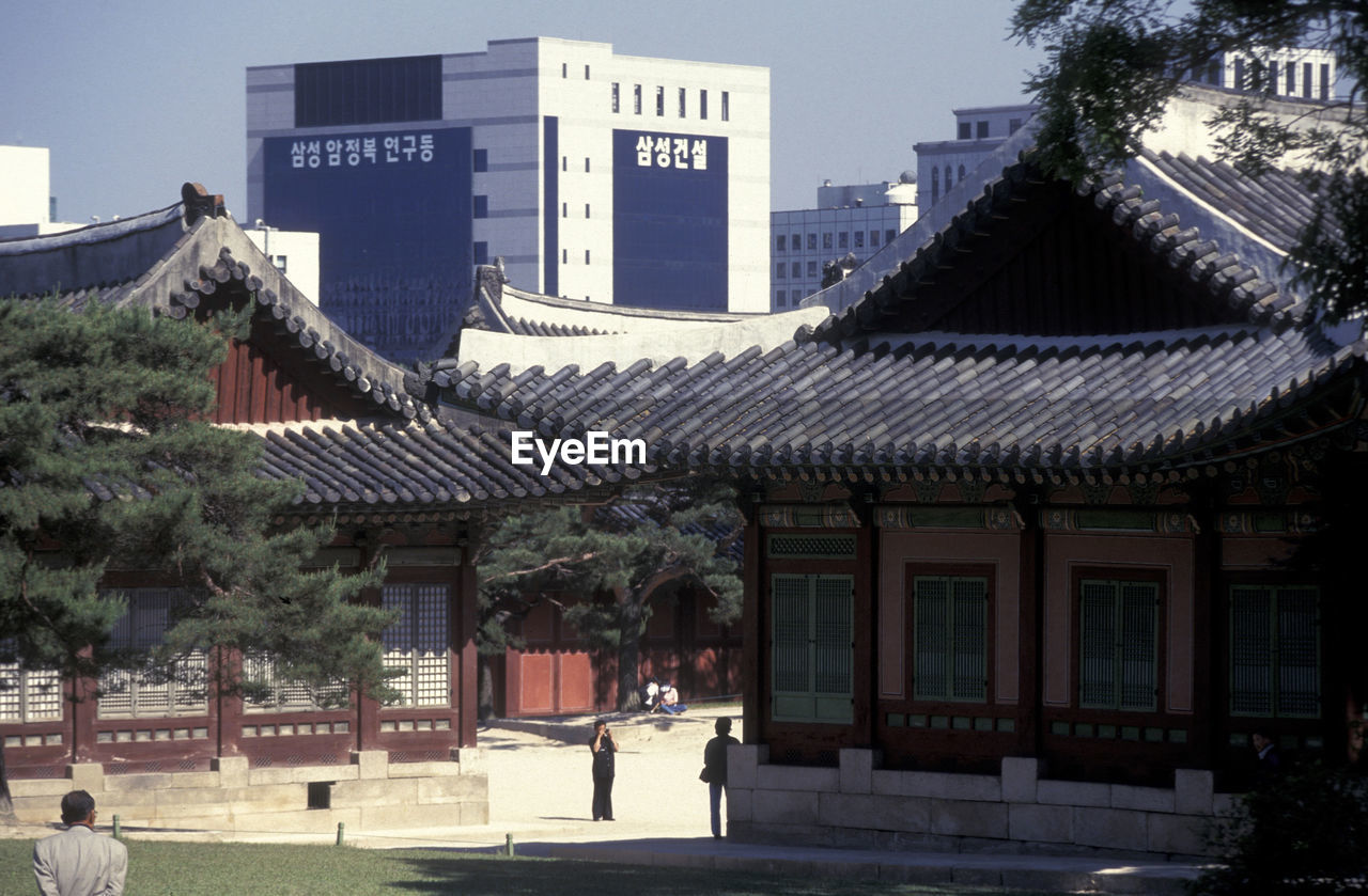 EXTERIOR OF BUILDING WITH CITY IN BACKGROUND