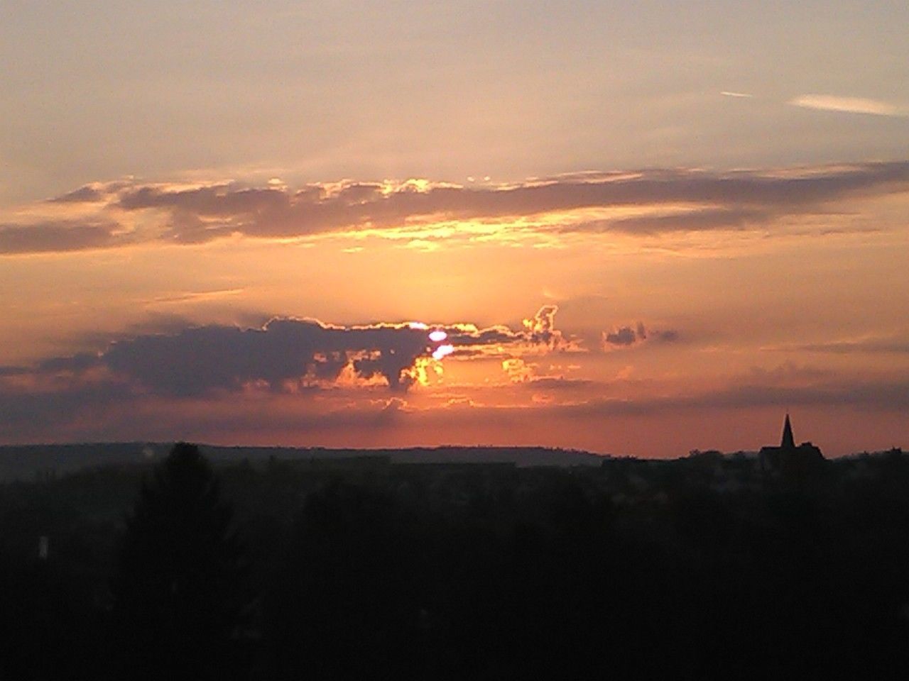 SILHOUETTE OF MOUNTAIN AGAINST SKY