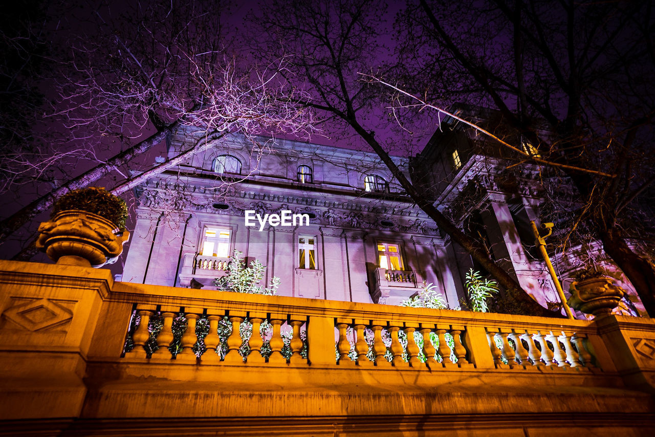 LOW ANGLE VIEW OF ILLUMINATED BUILDING