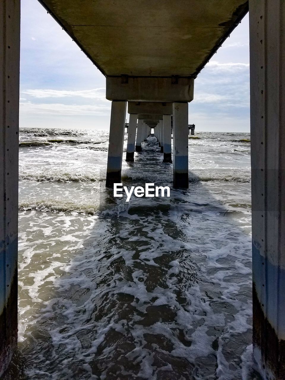 Scenic view of pier over sea against sky