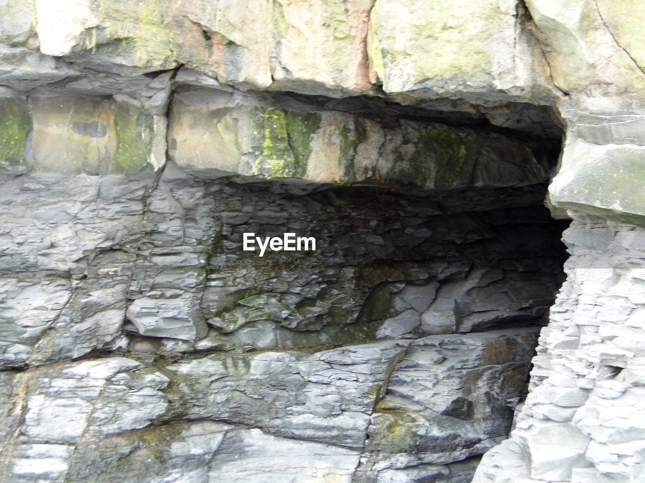 CLOSE-UP VIEW OF STONE WALL