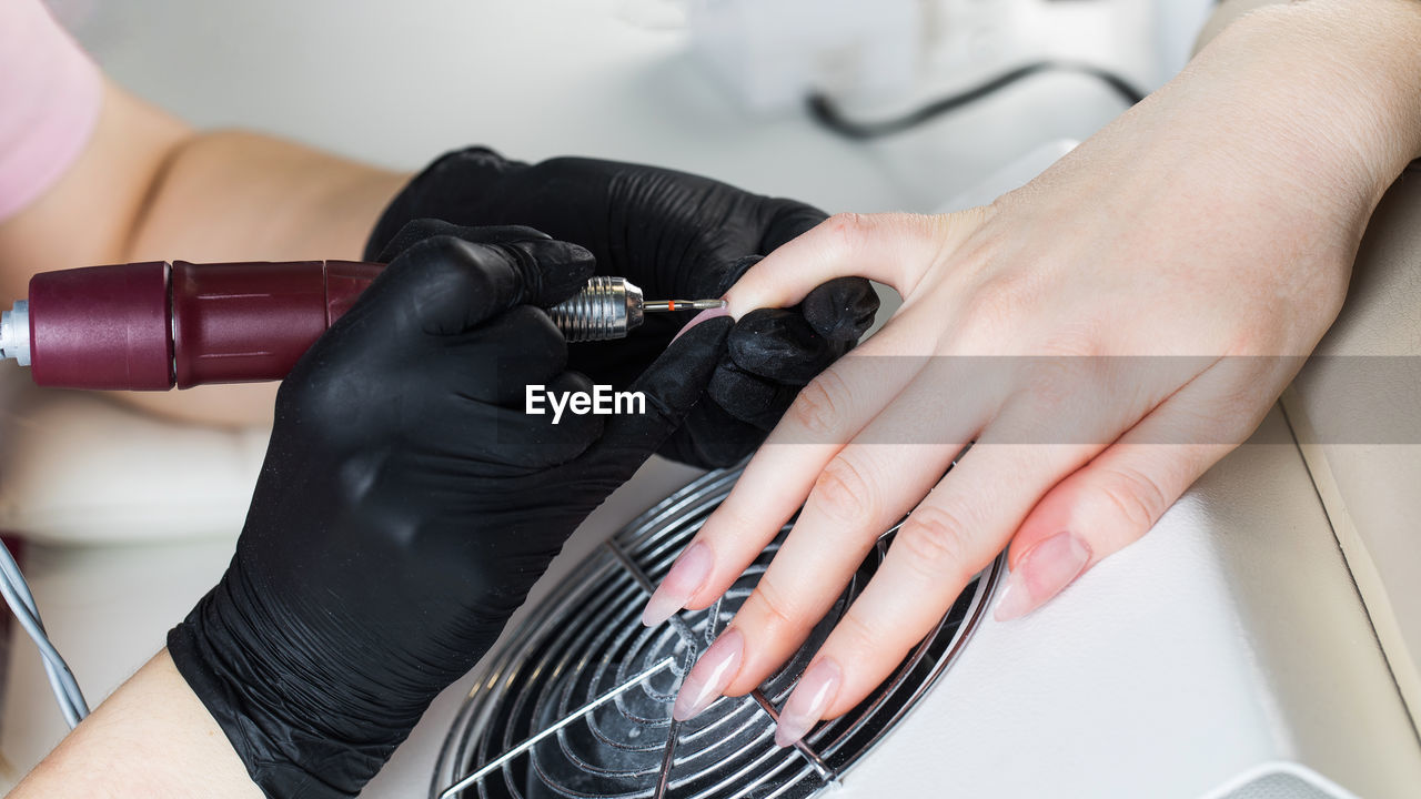 Hardware manicure. manicure process, cuticle removal with a cutter. processing 