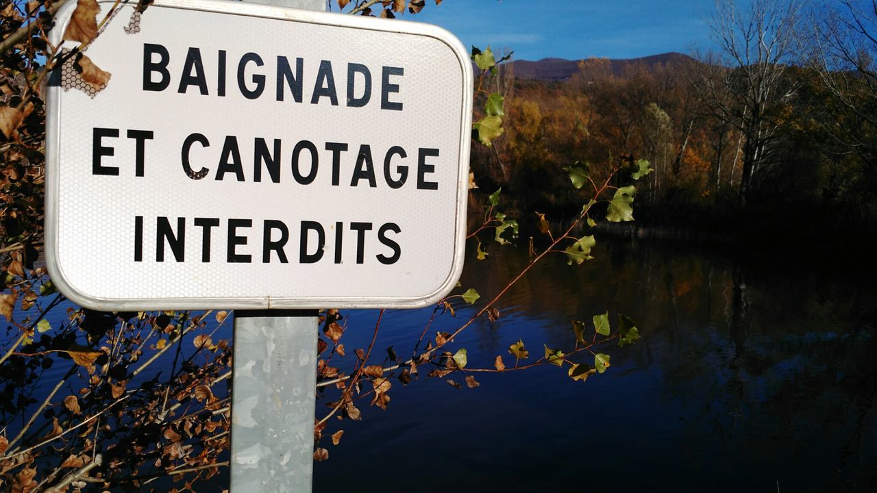 Information sign by lake