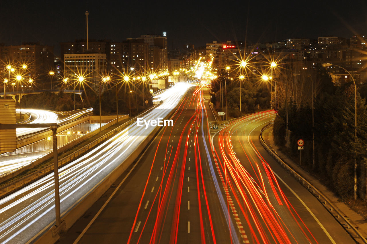 High angle view of light trails on city street at night