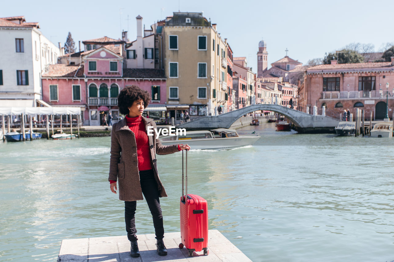 Young tourist woman going for vacation trip