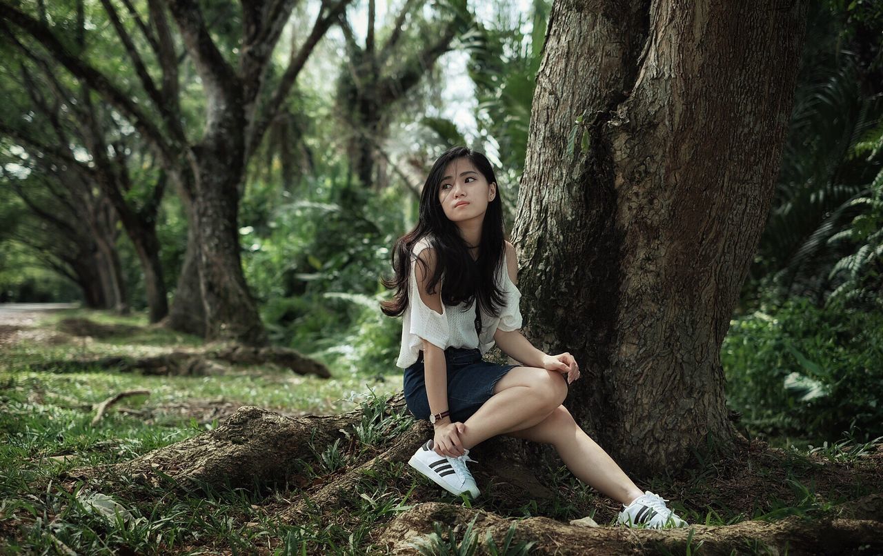 YOUNG WOMAN IN FOREST