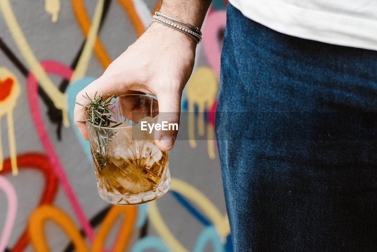 Close-up of man holding drink