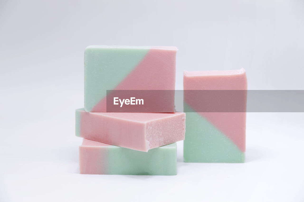 Close-up of soaps on white background