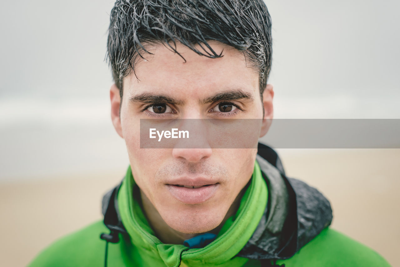 Close-up portrait of man during rainy season