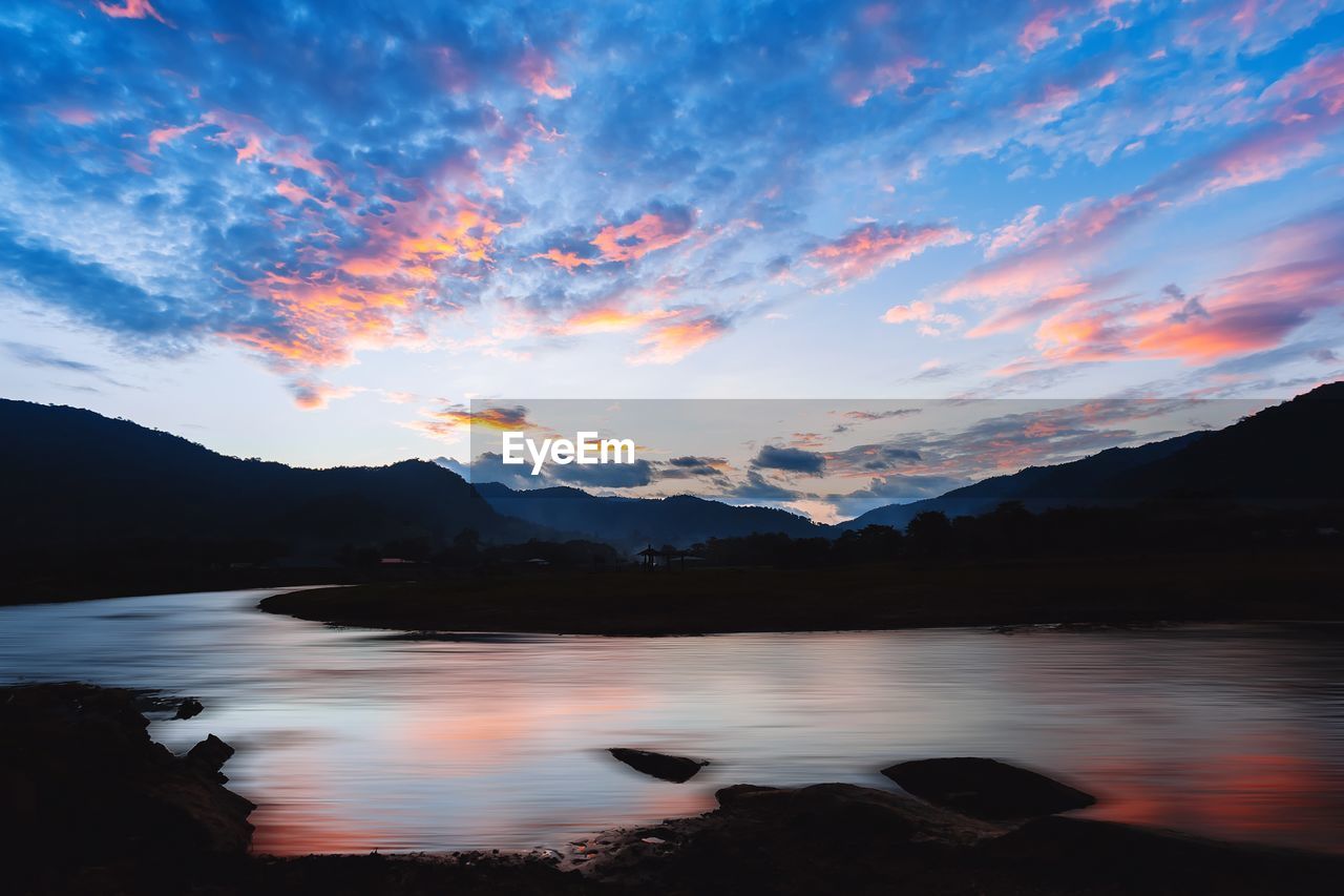 Scenic view of lake against sky during sunset