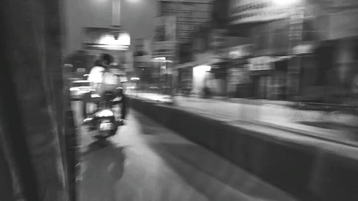 BLURRED MOTION OF CITY STREET AT NIGHT